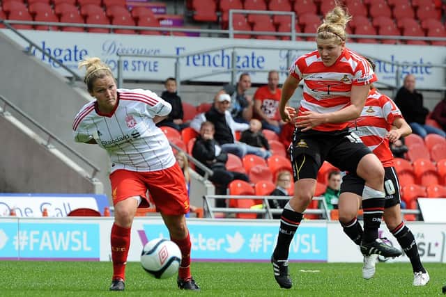 Doncaster Belles' Millie Bright has a shot on goal against Liverpool in 2012