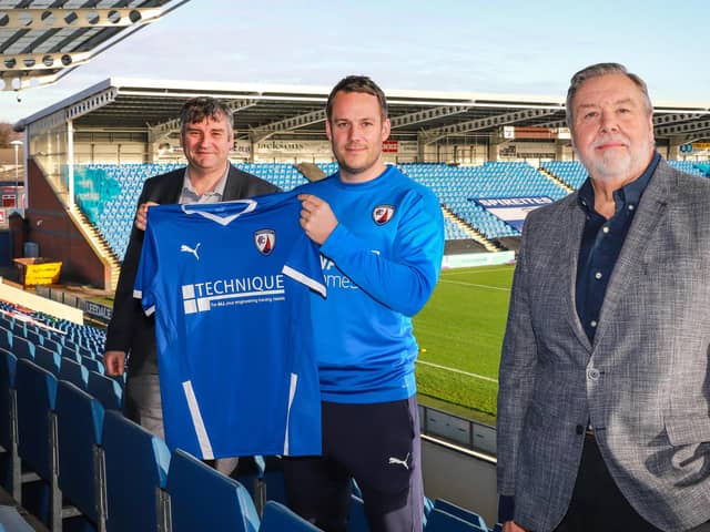 Jame Rowe pictured with chief executive John Croot (left) and chairman Mike Goodwin. Picture by Michael South.
