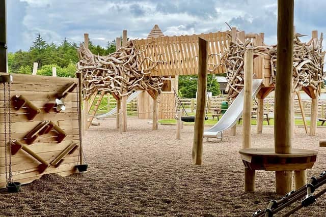 The Enchanted Hamlet at Matlock Farm Park has been built from rustic oak, larch and stagwood. The adventure zone features an internal climbing wall, a timber tangle climbing frame and slides.