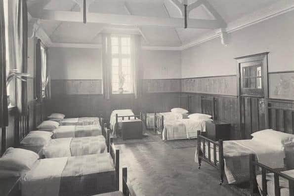 Neatly made beds in the dormitory.