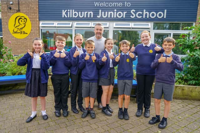 Kilburn Junior School at the Flat, Kilburn, has been rated as ‘good’ in an Ofsted report published on September 15, following a short inspection. Above headteacher Robert Hull celebrating with pupils.