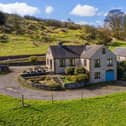 The farmhouse was built in 1979 and is clad in stone and has a tiled roof. Planning permission is in place to convert the traditional building adjacent to the farmhouse into a two-bedroom cottage.