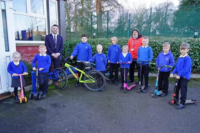 Bramley Vale Primary School unveils new bike and scooter store and basketball nets. Seen are pupils with Coun James Barron County, councillor for Tibshelf, and headteacher Rob Rumsby