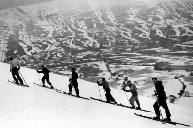 Winter sports enthusiasts enjoying the rare opportunity to ski on the slopes of Kinder Scout on 31st January 1939.