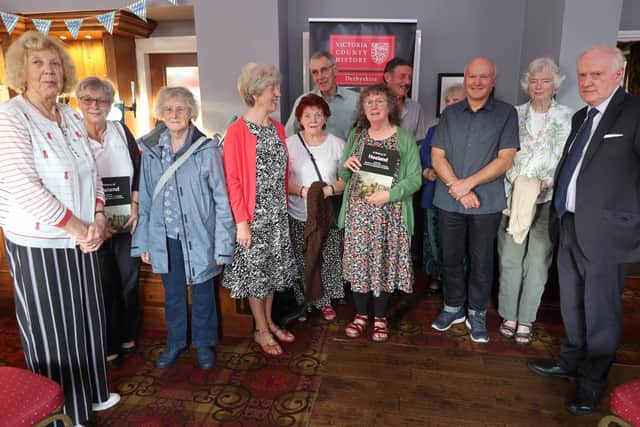 Philip Riden, pictured far right, with some of the volunteer group who have contributed to the new book on Hasland. Holding the book is Lyn Pardo Roques, who chairs the Derbyshire Victoria County History Trust.