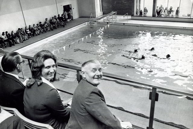 Famous face in the crowd watching a swimming display at the new Clay Cross Swimming Baths is Oympic breast stroke champion Anita Lonsbrough, who earlier had officially opened the pool.  With her is Coun Bernard Smith, Chairman of Chesterfield and Clay Cross RDC, July 1, 1972