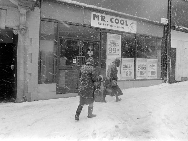 A rather apt name for the shop in the background.