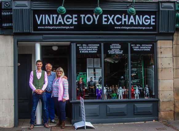 From left, family shopkeepers Alex, John and Julie Morgan.