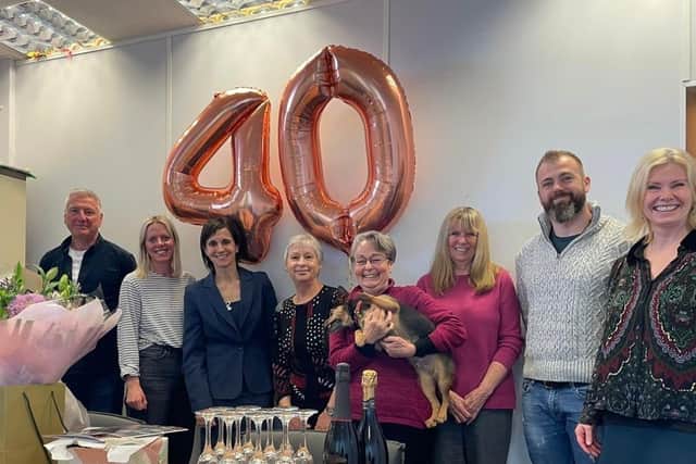 Teresa Cresswell, with Jasper the dog that she has fostered, is flanked by trustees Rick Barnett, Lucy McManus, Amy Harris (CEO), Jean Webb, Helena Douch, Joe Etherington and Tracy Marsh (Operations Manager), pictured from the left.