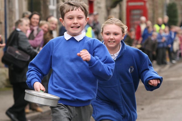 Joshua Wood and Phillipa Marsden, year five pupils at Winster Primary School, race for the finish line in 2009.