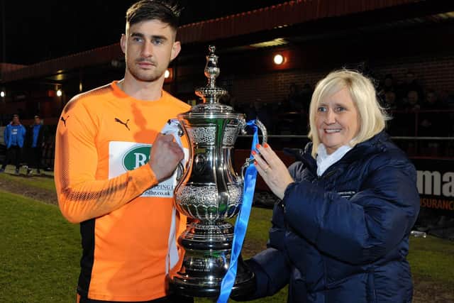 Chesterfield's Joe Anyon pictured with the Derbyshire Senior Cup in the 2017/18 season.