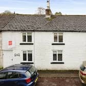 The terraced property on Sherwood Road, Tideswell has an attached garage.