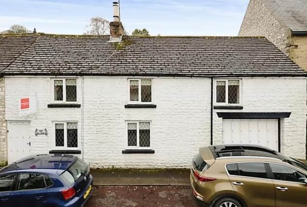 The terraced property on Sherwood Road, Tideswell has an attached garage.