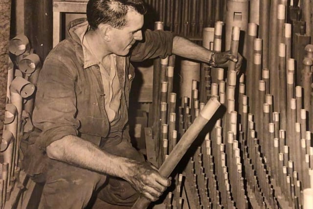 This picture taken in 1963 shows a man working on the pipes of Sheffield Cathedral