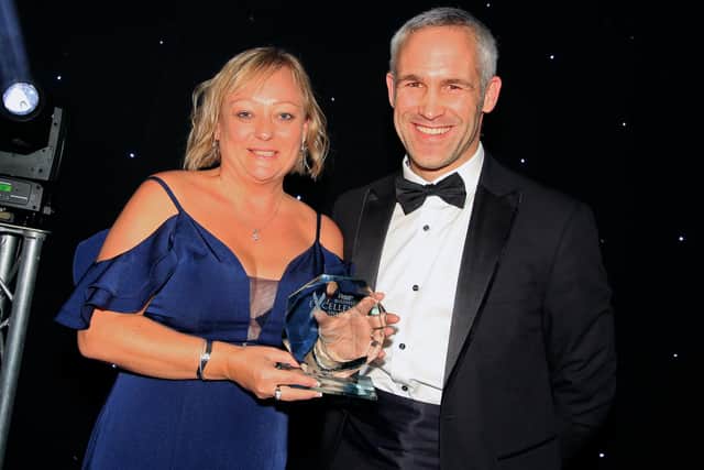 Chris Sankey, CityFibre East Midlands Area Build Manager, pictured presenting the award for Business of the Year to Marie Cooper of CBE+
