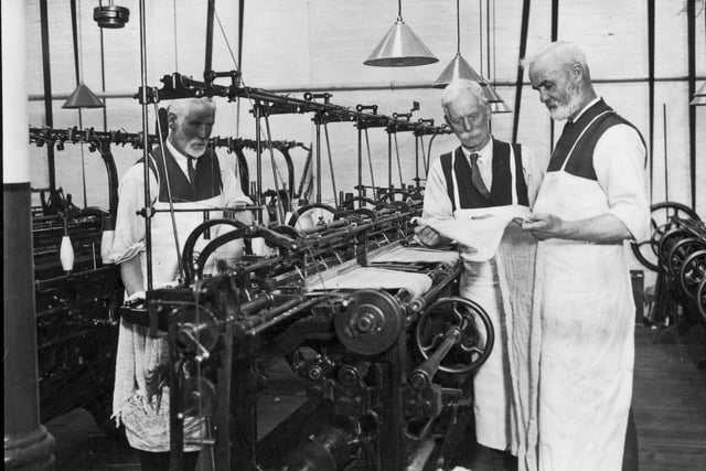 May 1928:  Three workers at the I & R Morley cloth-weaving factory in Heanor, Derbyshire.  (Photo by Edward G. Malindine/Topical Press Agency/Getty Images)