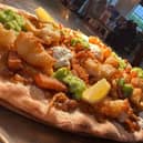 The Devonshire Arms has blown customers away with their fish and chips pizza, featuring a curry sauce base and topped with mushy peas.