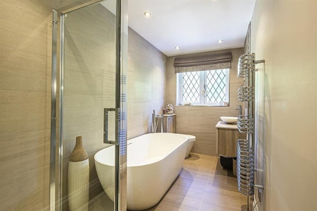 This family bathroom comes with all the essentials: a shower, bath, toilet and wash basin, as well as, a heated towel radiator.