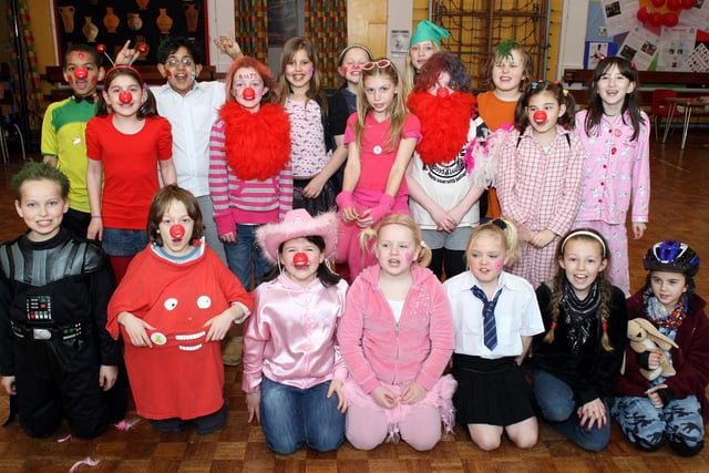 Bakewell Methodist Junior School wear a variety of wacky and wonderful costumes for Red Nose Day in 2009.