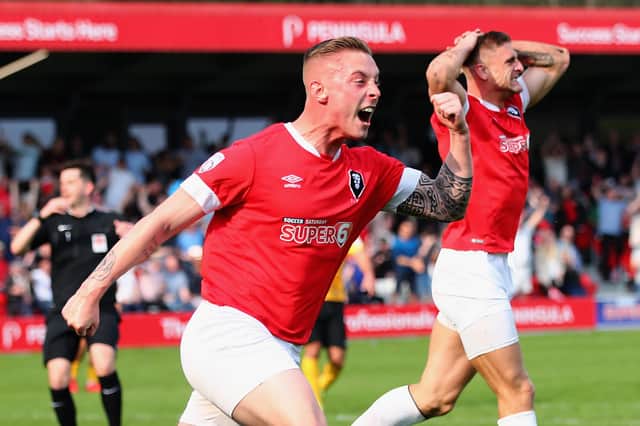 Josh Askew celebrates a Salford City goal during his time with the club.