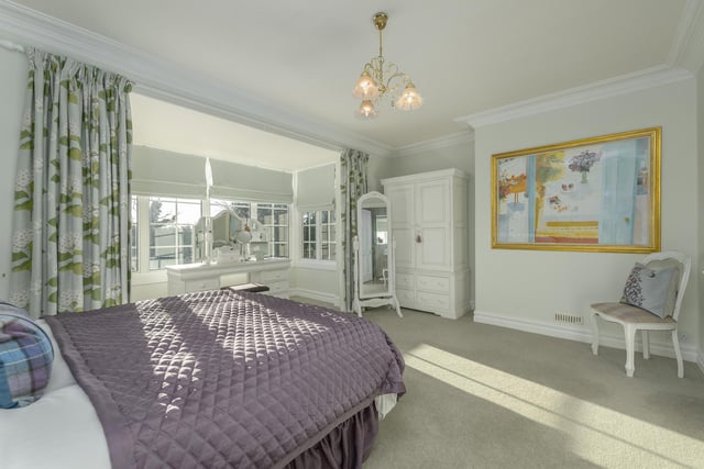 A second large double bedroom with fantastic bay window also has en-suite and dressing room space.