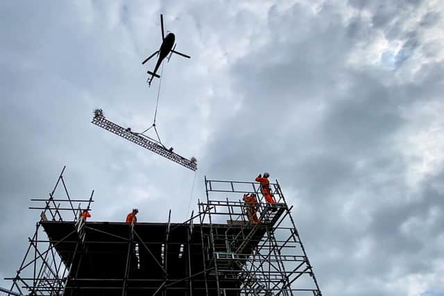 A helicopter hovering above the Cowburn Tunnel ventilation shaft