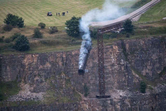 Hollywood came to Derbyshire in 2021 when the team behind Mission Impossible 7 - including actor Tom Cruise - filmed a train crash scene at the former Darlton Quarry in Stoney Middleton. Derbyshire photographer Villager Jim captured the dramatic moment the train went over the edge.