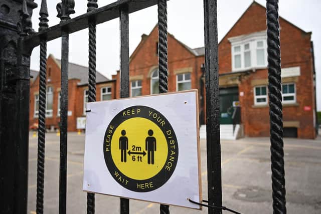 Parents are being reminded to maintain social distancing at all times outside schools. Photo: Oli Scarff/AFP/Getty Images