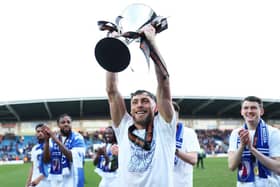 Mike Jones lifted the National League trophy in 2024.