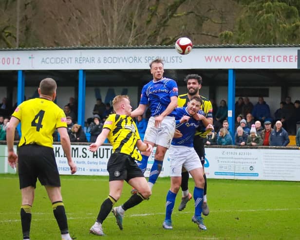 Adam Yates goes up for a header in the draw with Worksop. Photo: Michael South Photography.