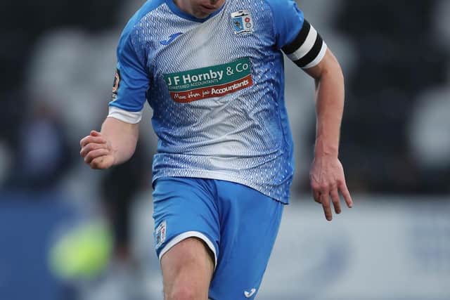 John Rooney, who scored 20 goals for champions Barrow last season, has signed for Stockport County.