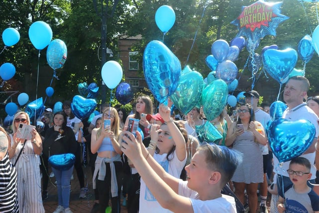 Some of the balloons said 'happy birthday' and most were blue, Logan's favourite colour.