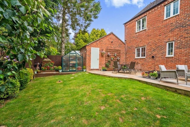 A second shot of the garden, which is mainly laid to lawn and is fully enclosed with a fenced boundary offering privacy. It also offers access to the garage