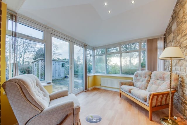 The sun room is a relaxing space that also has French doors leading out to the back garden.