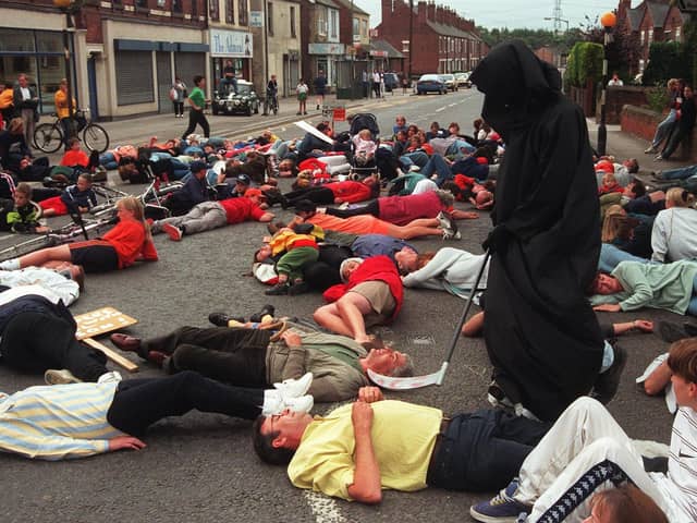 Pictured in Killamarsh, where protestors blocked off the Sheffield Road, and fell to the ground as if dead, when SARP tested its new warning siren, as they lay in the road the grim reaper passed among them. Protestors wanted the SARP site closed.
