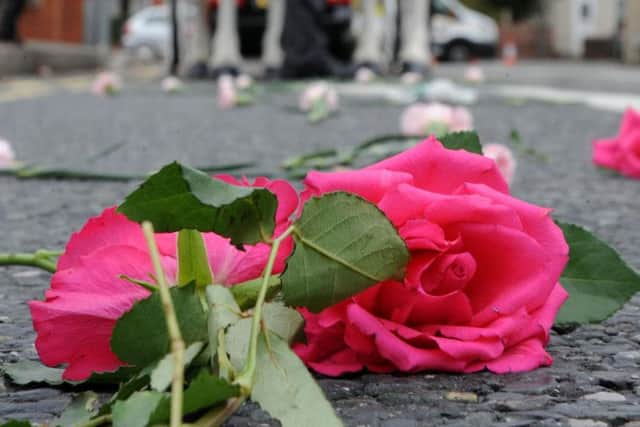 Flowers on the road at Sarah Freckingham's funeral. Picture: Anne Shelley.