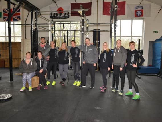Crossfit 252 owners Paul and Sarah Roberts pictured with members. Picture: Rachel Atkins.