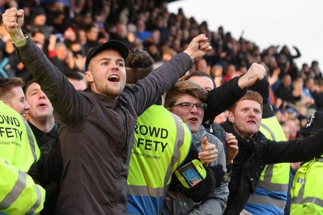 Chesterfield fans celebrate a goal.