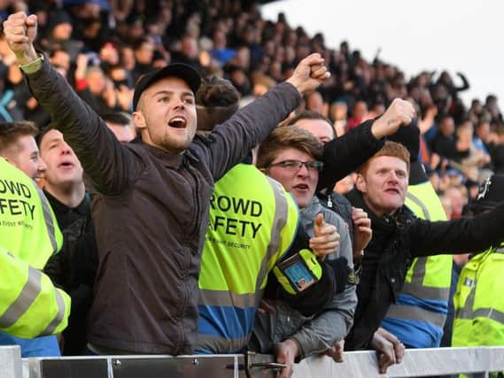 Chesterfield fans celebrate a goal.