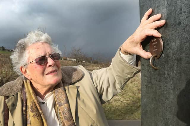 Maureen Finney with a figure which symbolises her father Arthur Henson who was killed in the 1938 tragedy.