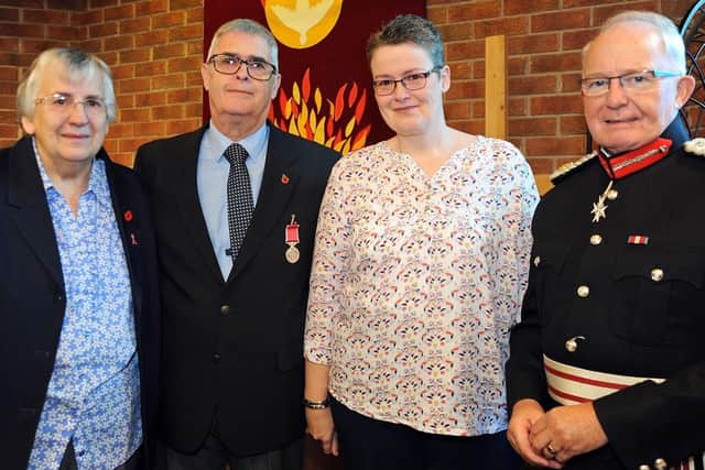 Mike Tye pictured with his wife Sandy and daughter Jo, and the Lord Lieutenant of Derbyshire William Tucker, after receiving his BEM at the St. Albans Parish Centre in Holmewood on Tuesday.