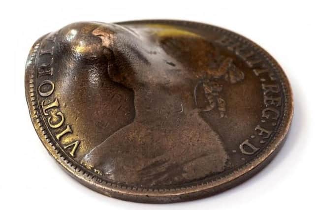 The penny which saved Private Trickett's life. Picture: Hansons.