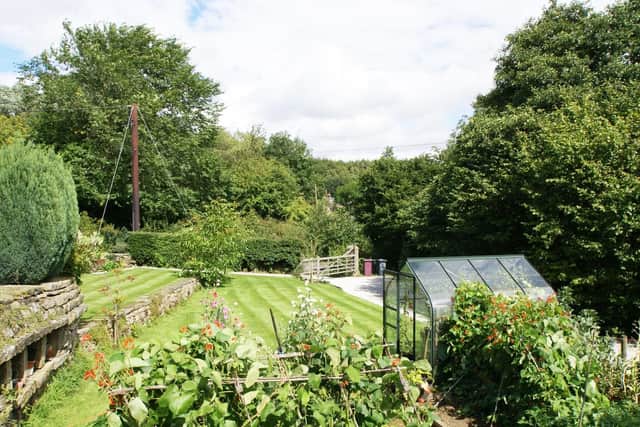 The garden is terraced and contains a vegetable plot.