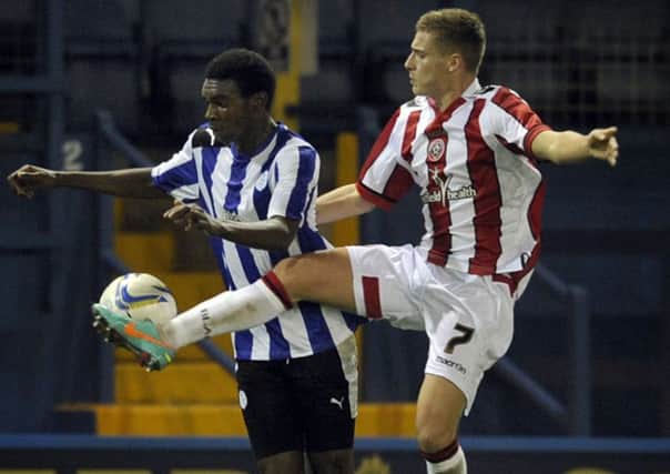 Jordan Chapell, pictured playing for Sheffield United U21s, battles for the ball with Owls' Hayden White
