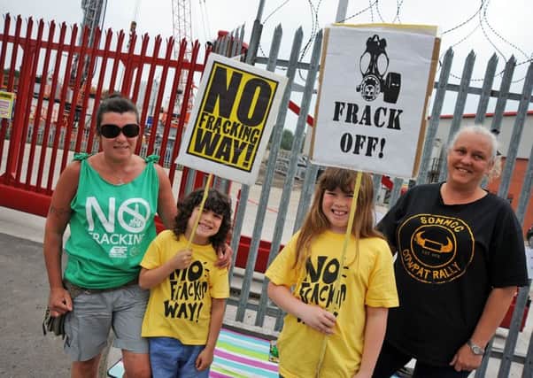 Anti-fracking protesters, Jayne with sons Cody, 6 and Kaiden, 9 and Yasmin Martin, from South Normanton, outside Marriott P R Drilling Ltd in Danesmoor.