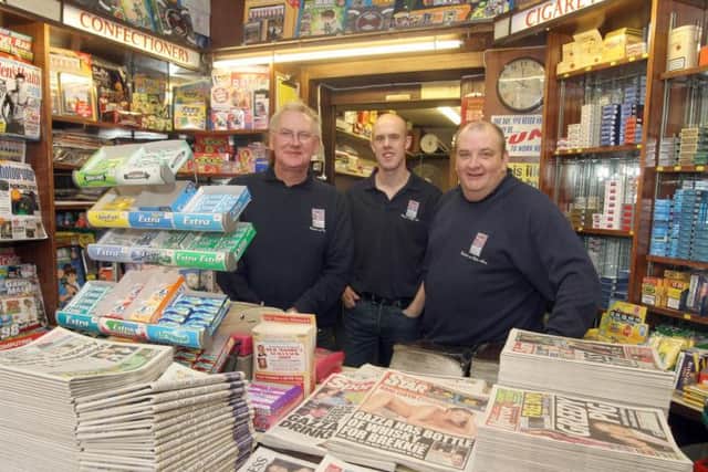 Mick Goddard, left, Chris Christopher, centre, and Chris White, right, in their shop in 2008.