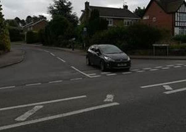 A car has been abandoned at a junction in Hasland.