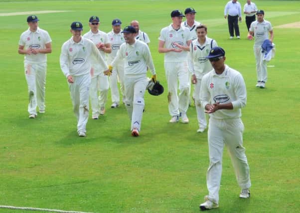 Chesterfield hero Josh Savage leaves the field to applause after his superb bowling return of 7-18 to set up victory against Denby in the Premier Division of the Derbyshire County League. (PHOTO BY: John Windle)