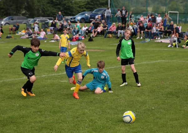 Action from Matlock's Festival of Football. Photo by Glenn Ashley.