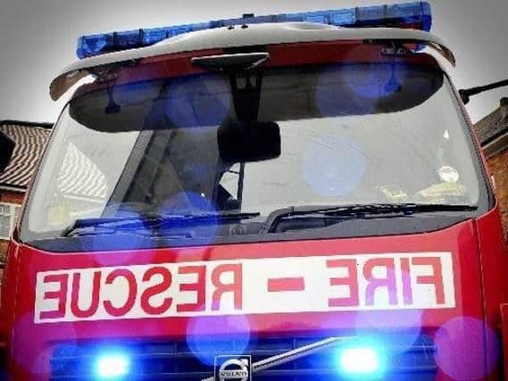 A man was taken to hospital with suspected back injuries after a one-car crash in Bispham, say fire services.